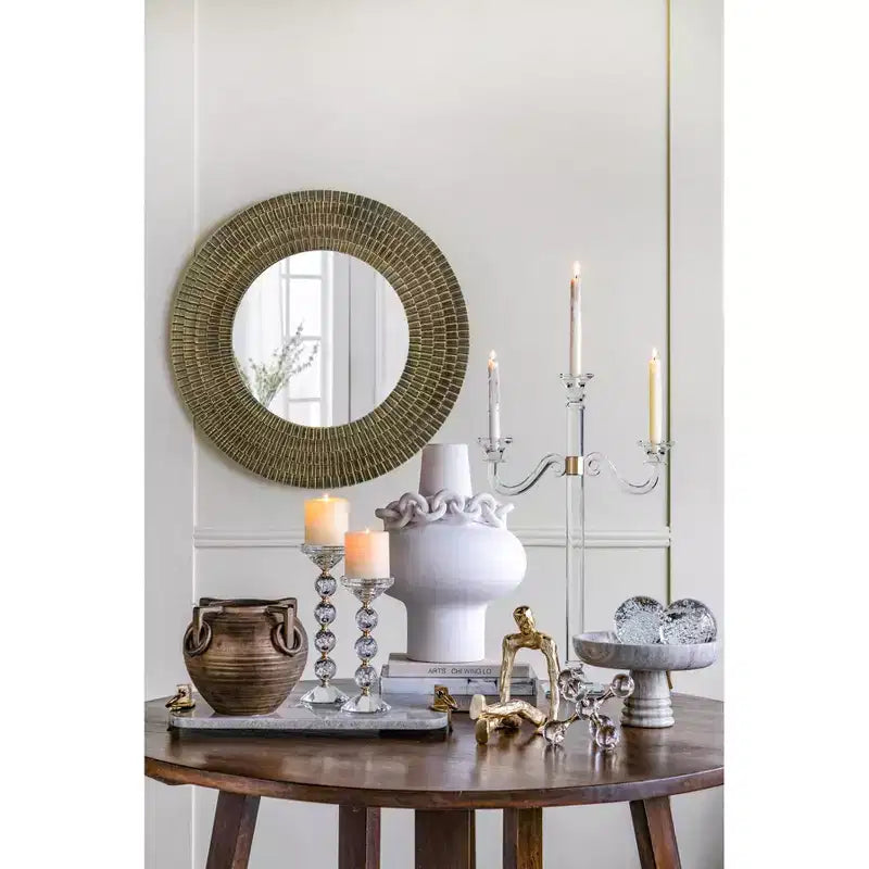 Miroir mural rond en bois doré et noir à texture tissée
