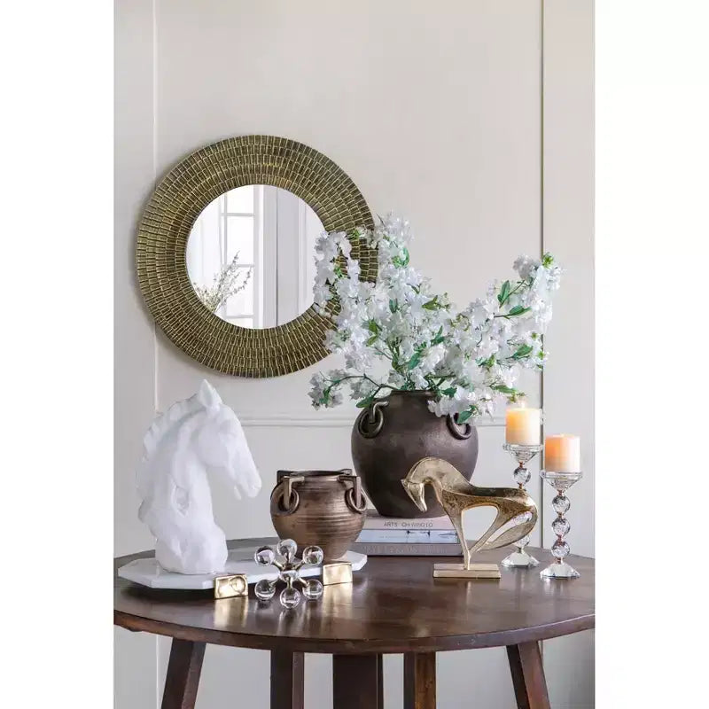 Miroir mural rond en bois doré et noir à texture tissée